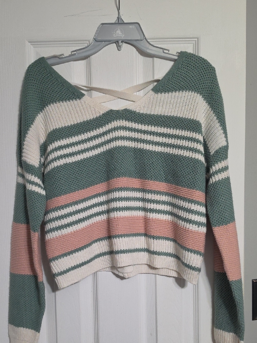 FCT with Love knit sweater featuring a striped design in green, white, and pink.